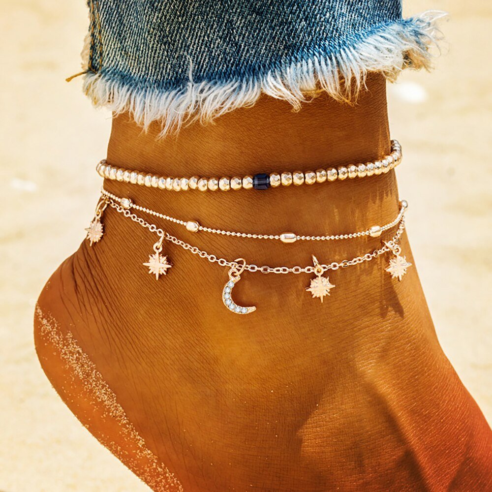 A woman wearing a celestial anklet set.