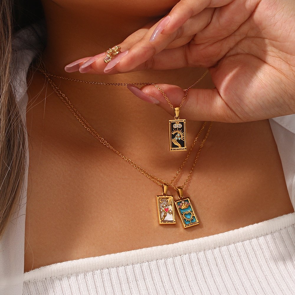 A model wearing multiple Tarot Card Amulet Necklaces.