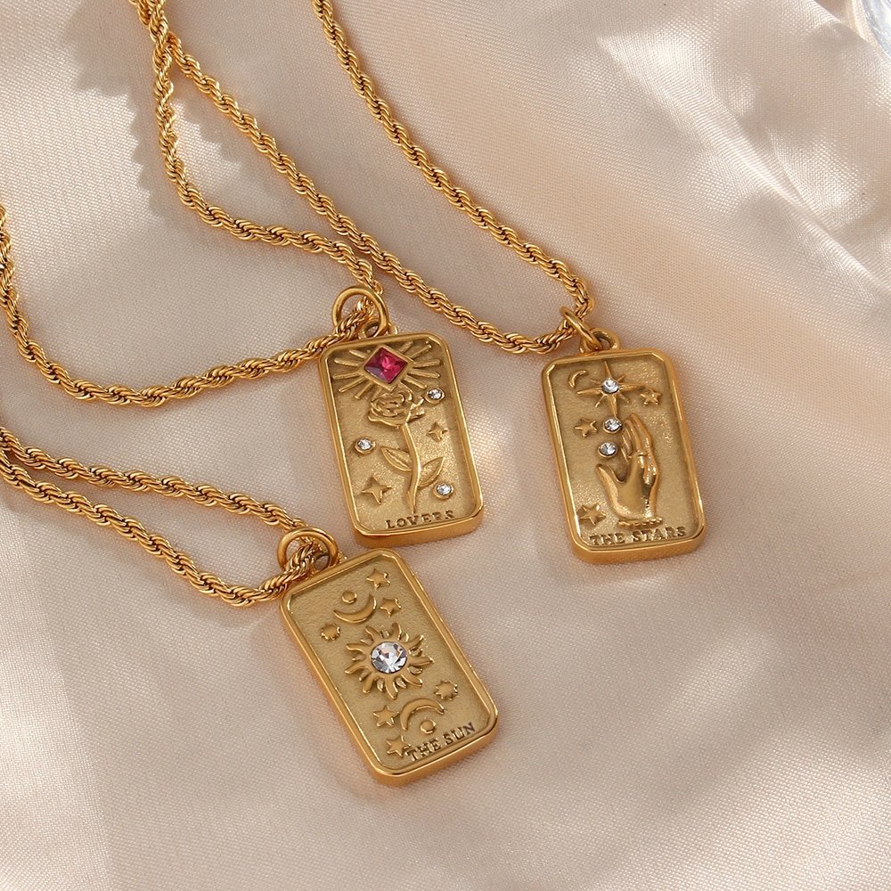 Three Gold Tarot Card necklaces.