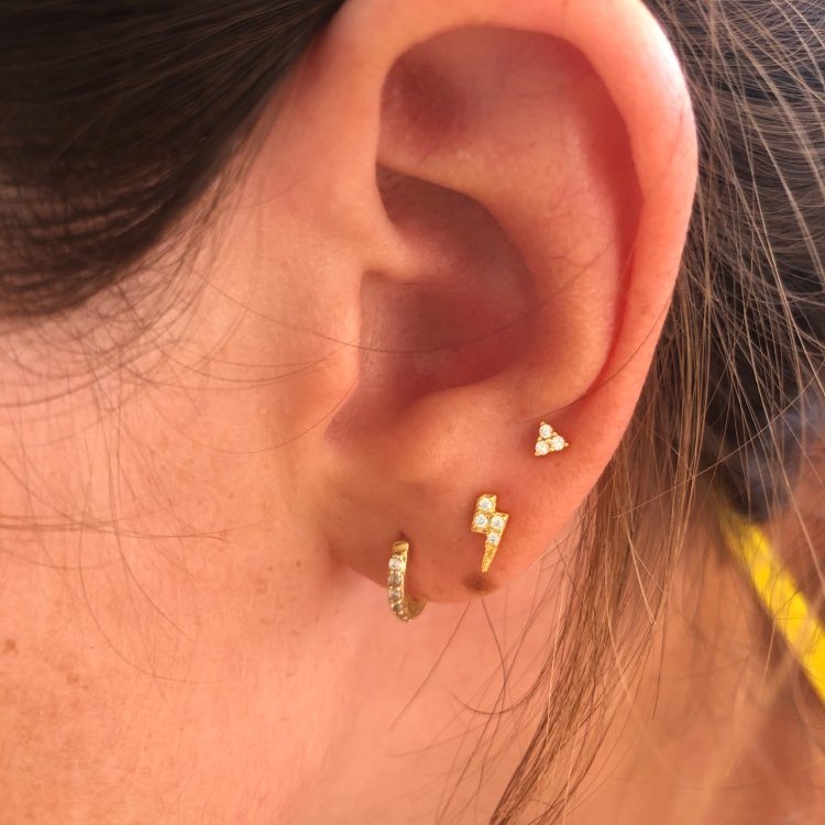 A model wearing Teeny Lightning Bolt Studs.