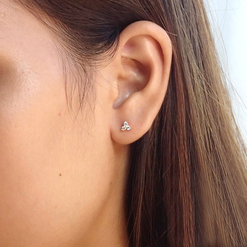 A model wearing Trinity CZ Stud Earrings.