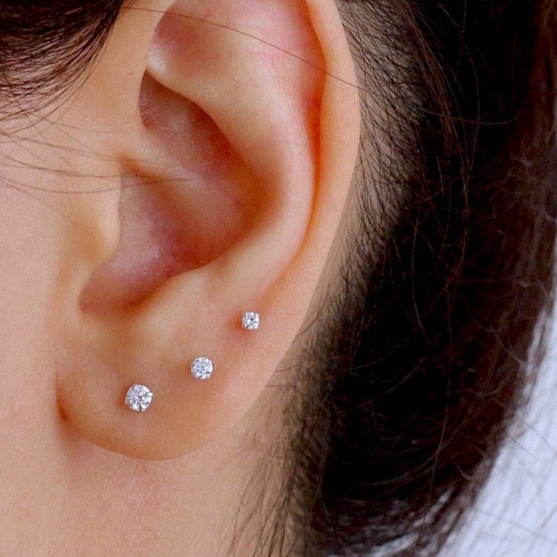 A model wearing three sizes of Tiny CZ Studs.