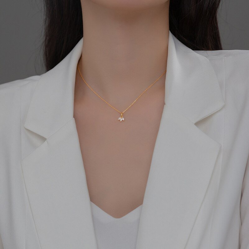 A model wearing the Triple Marquise Necklace.