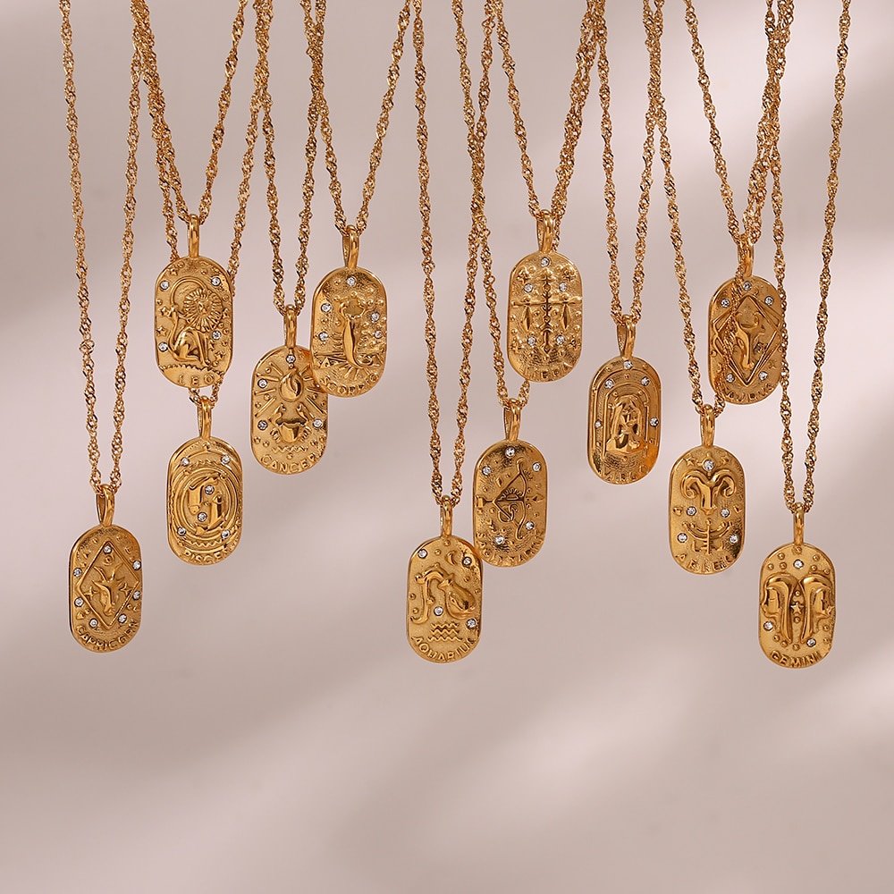 Tweleve Zodiac Amulet Gold Necklaces hanging.